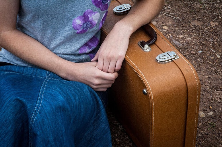 a woman with a suitcase wonders what is eating disorder treatment like