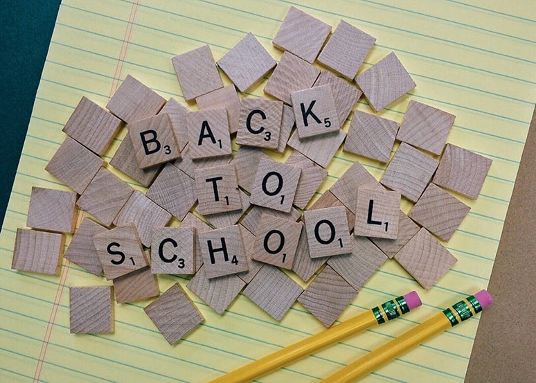 Scrabble letters spelling 'back to school'