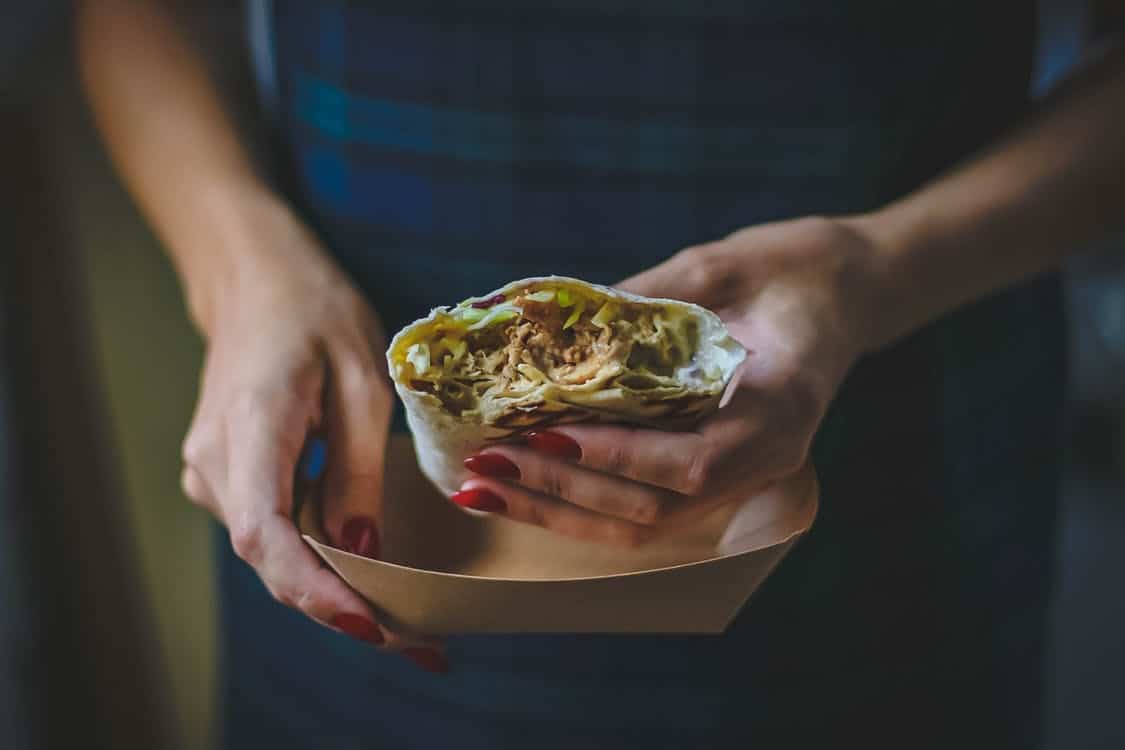 Woman with a burrito stock photo