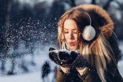 Girl in snow at Christmas