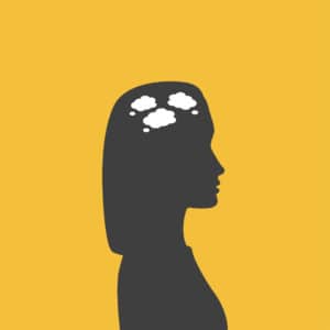 Silhouette of a woman with thought clouds in her head.